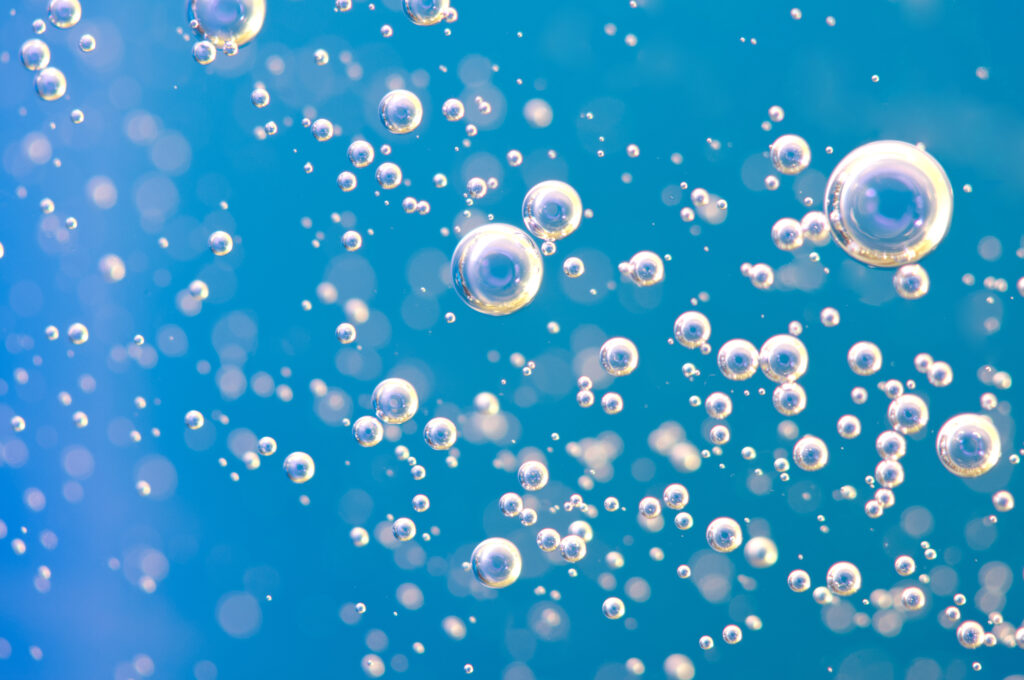effervescent bubbles on light blue background
