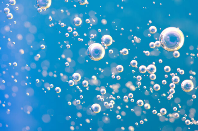 April-22-2019-bubble effervescent bubbles on light blue background