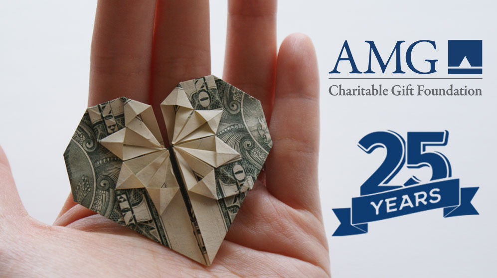 Handing holding US dollar folded into a heart shape with logo for AMG Charitable Gift Foundation and label "25 Years".
