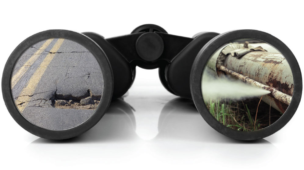 Binoculars with images of cracked concrete and rusting pipes in lenses.