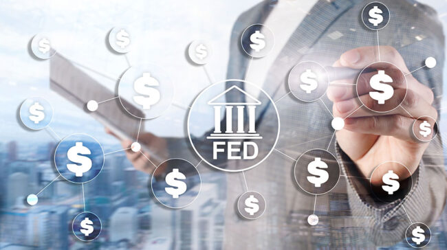 Torso of a suited person overlaid with $ icons with FED building icon in center.