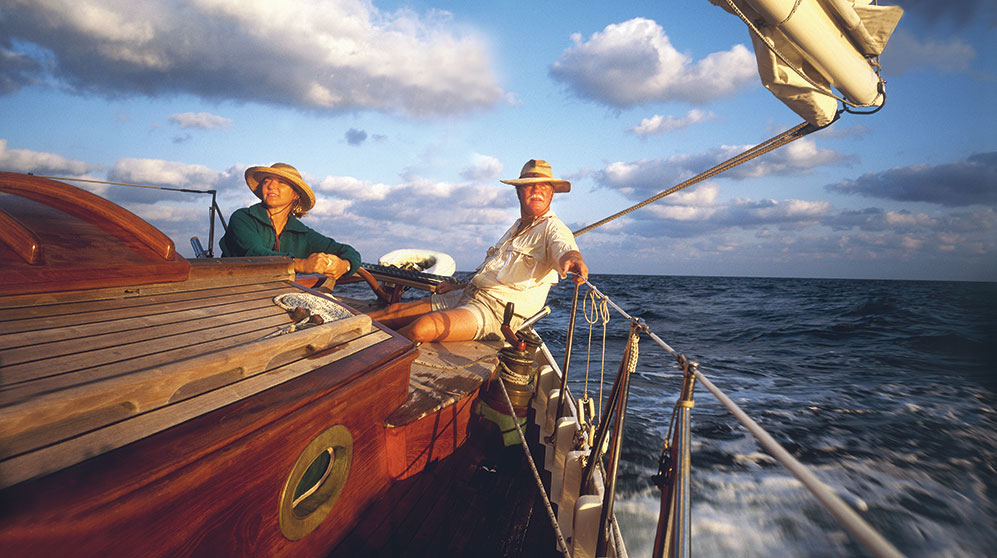 Retirement Planning: Photo of a carefree retired couple enjoying sailing