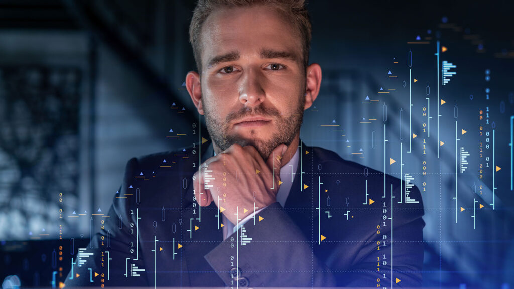 Suited man looking pensively at a glowing screen overlaid by market performance graphics.