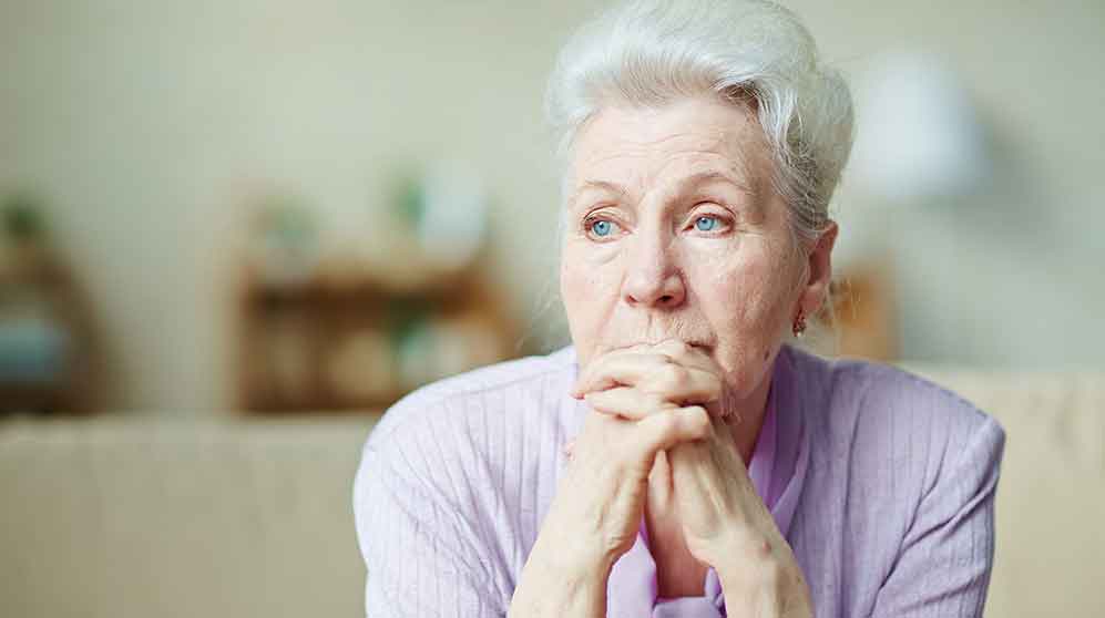 older woman deep in thought