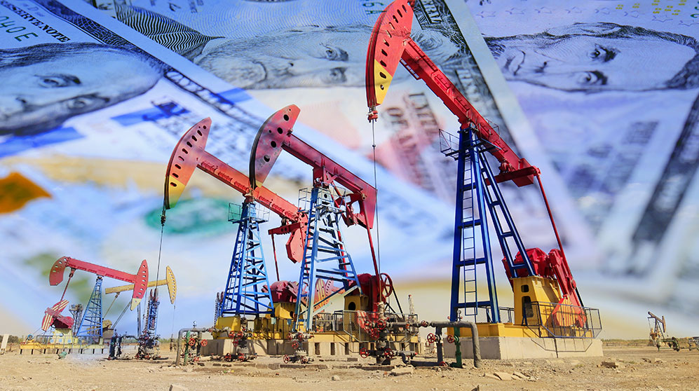 red oil rigs working with mashup of U.S. currency