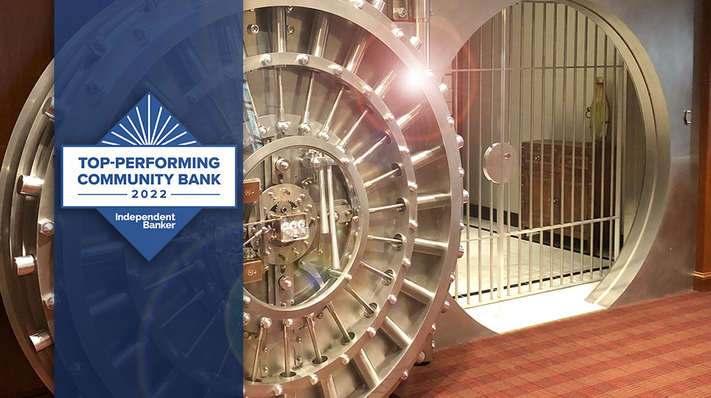 Bank vault with top-performing community bank of 2022 award badge by Independent Banker magazine