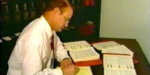 man doing tax preparation at desk