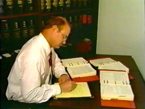 man doing tax preparation at desk