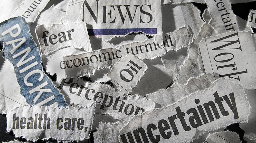 headlines hand torn from newspapers: uncertainty, health care, oil, perception, economic turmoil, fear, news