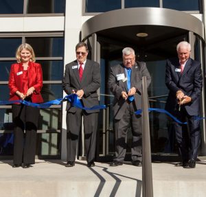 Senior executives at AMG National Trust cut ribbon on new headquarters in Greenwood Village, CO