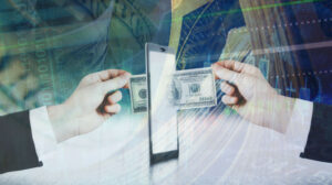 money passing through a laptop between two people