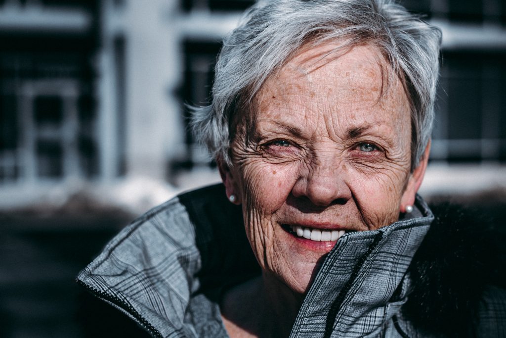 Elder woman smiling.