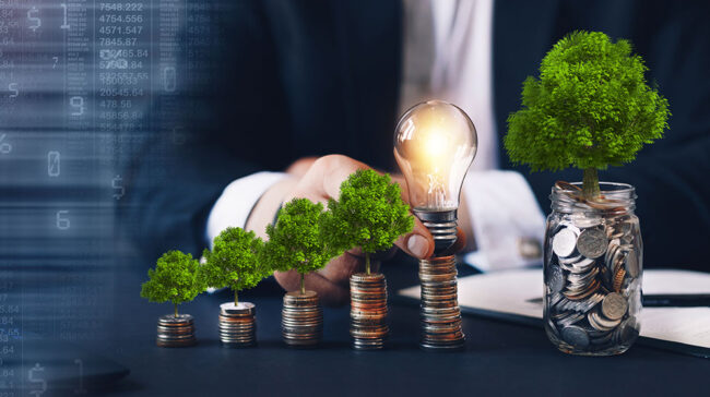 Image showing person growing trees out of jars of money, symbolizing natural resource investing