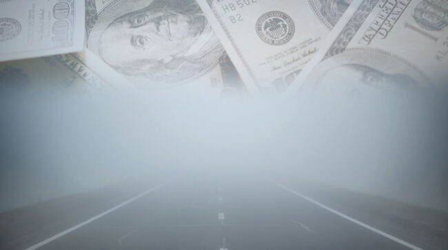 Image collage of a foggy road, with money superimposed over it