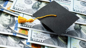 Photo of a graduation cap and money