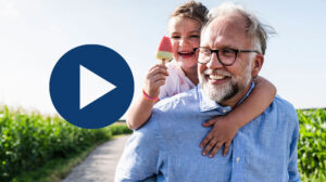 Photo of a grandpa playing with his grandchild