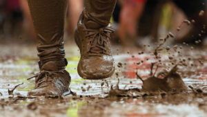 Photo of someone running in the mud