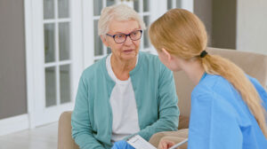 Photo of an older woman with a health care worker