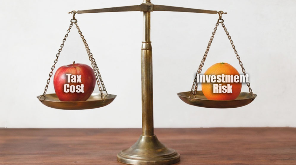 Photo Comparing the Tax Cost Against the Investment Risk
